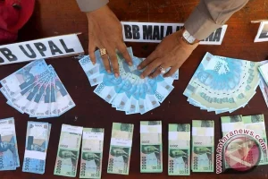 Polri dan BI Musnahkan 466 Ribu Lembar Uang Palsu